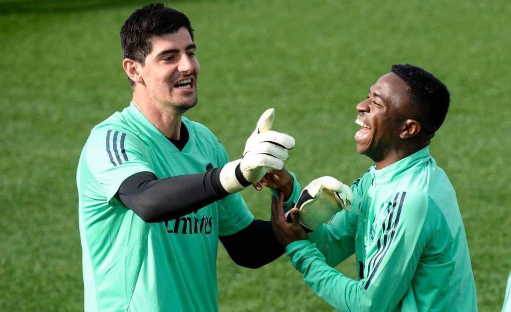 Thibaut Courtois and Vinicius Junior laughing at Real Madrid training