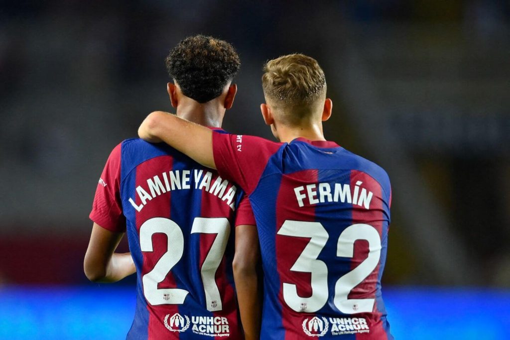 Lamine Yamal and Fermin Lopez hugging
