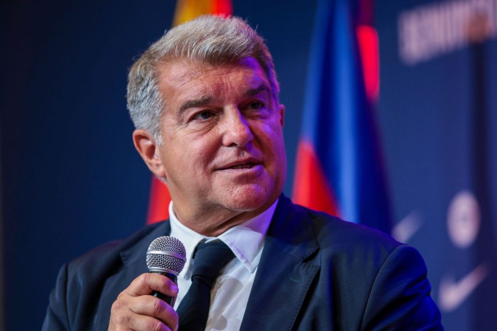 Barcelona president, Joan Laporta, holding a microphone