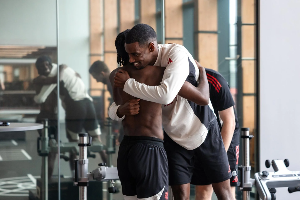 Jeremie Frimpong and Alexander Isak hugging in training
