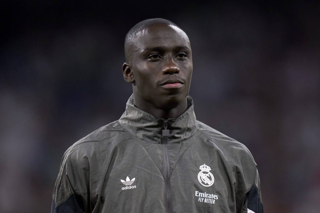 Ferland Mendy in a Real Madrid jacket smilling