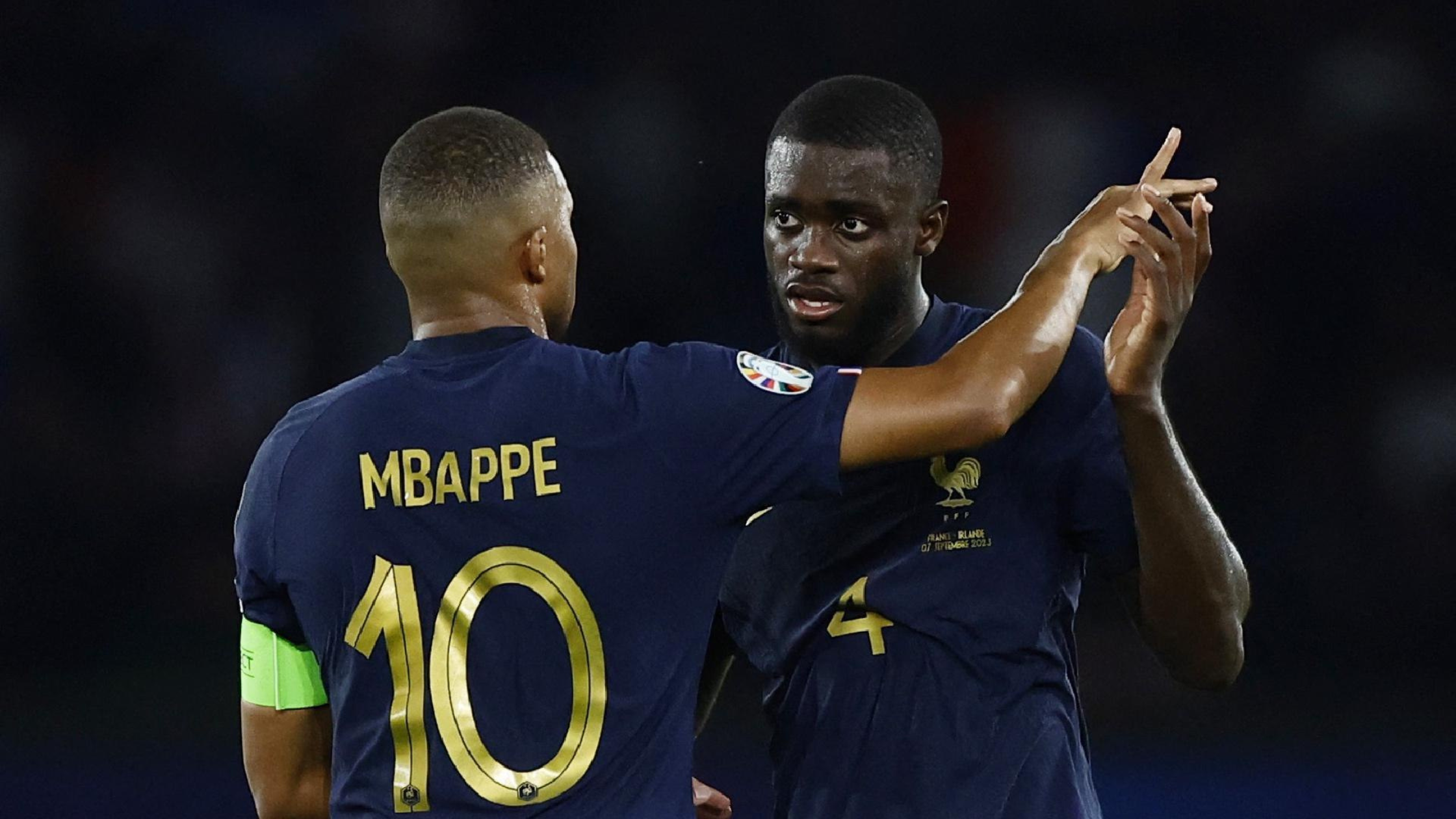 Mbappe and Upamecano hugging while playing for France