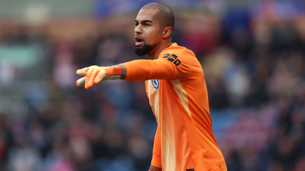 Sideview of Robert Sanchez commanding the defence for Chelsea