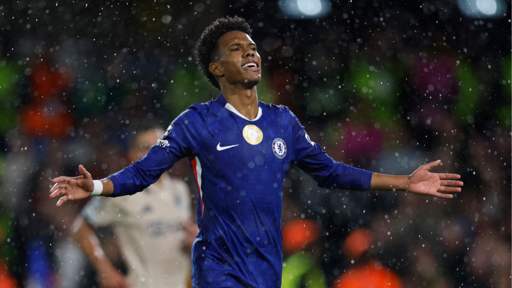 Estevao playing for Chelsea on a rainy night