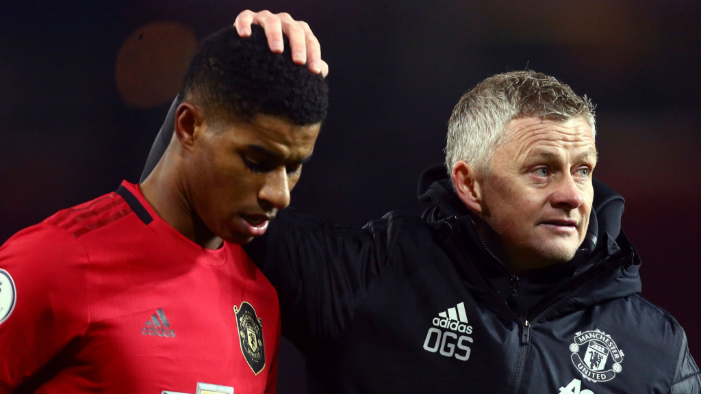 Ole Gunnar Solskjaer patting Marcus Rashford