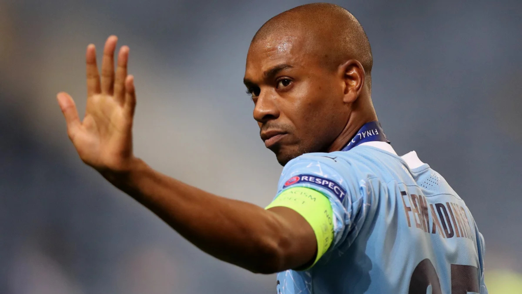 Backview of Fernandinho waving goodbye while playing for Manchester City