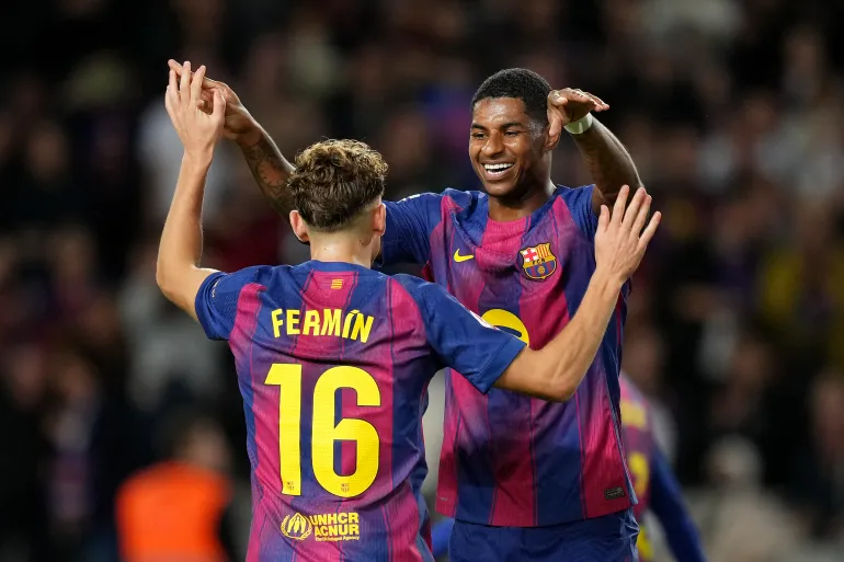Marcus Rashford and Fermin Lopez celebrating a goal for Barcelona