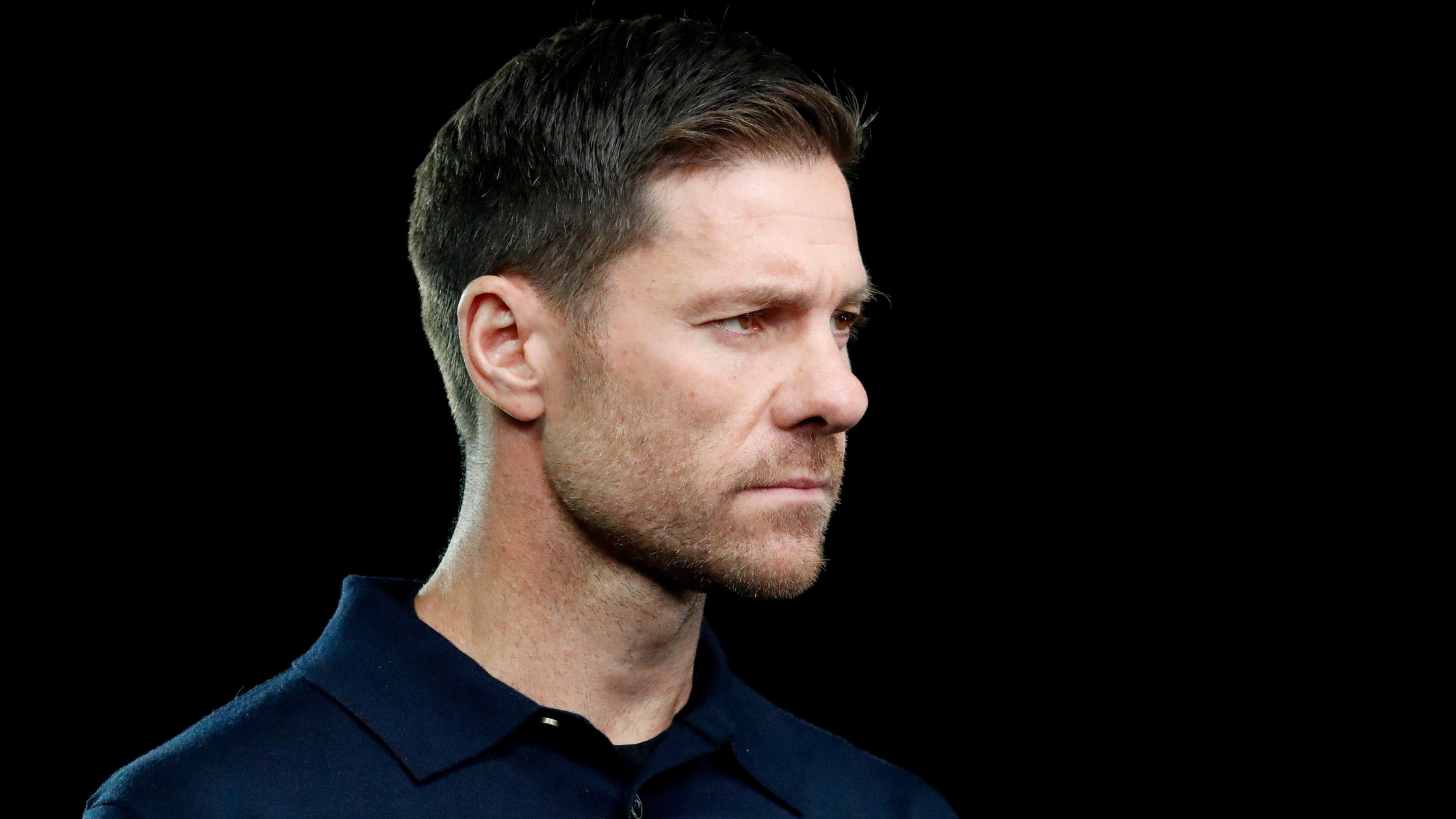 Sideview of Xabi Alonso looking focused