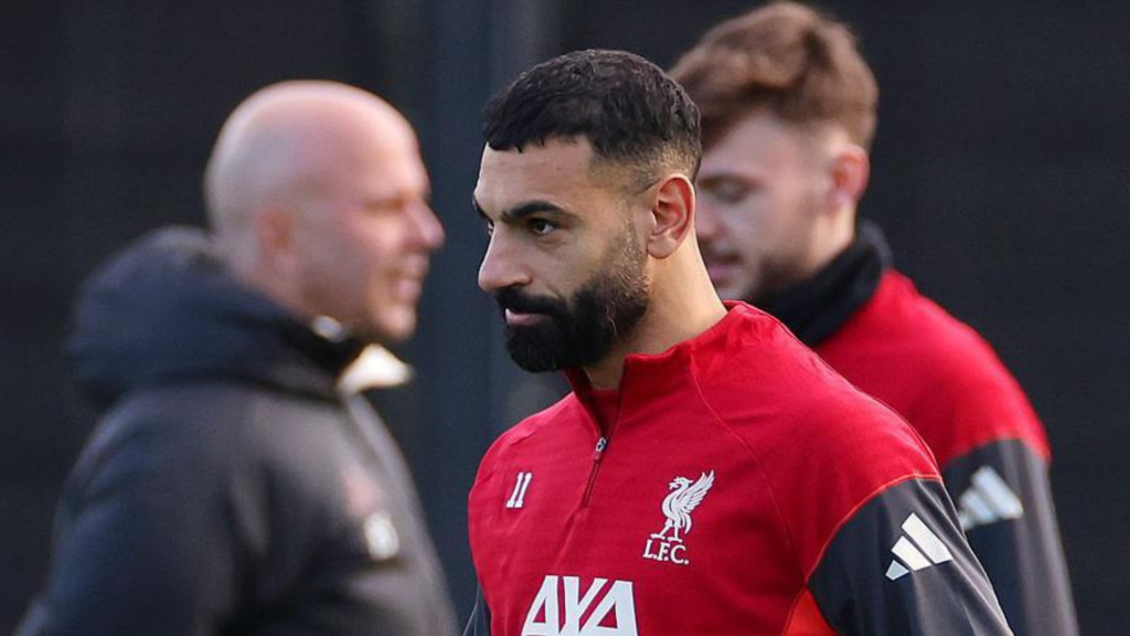Mo Salah in training with Arne Slot in the background