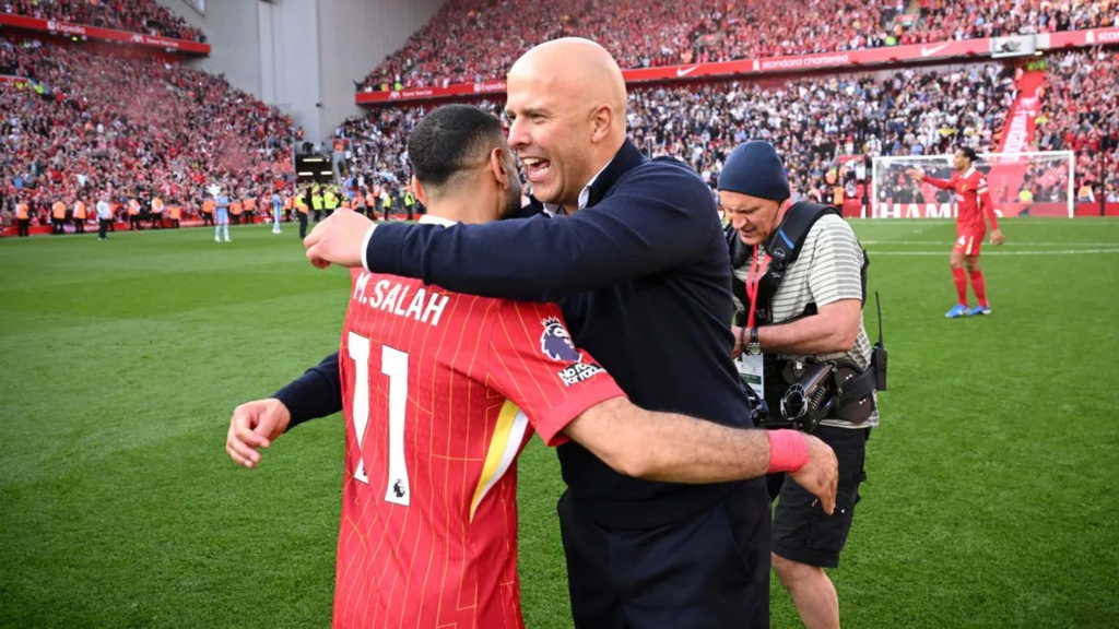 Mo Salah and Arne Slot hug