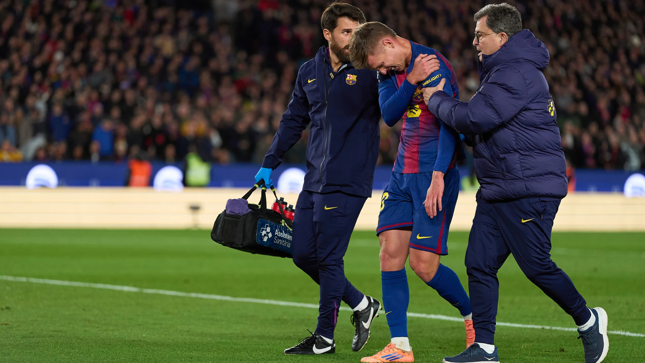 Dani Olmo walking off the pitch, injured