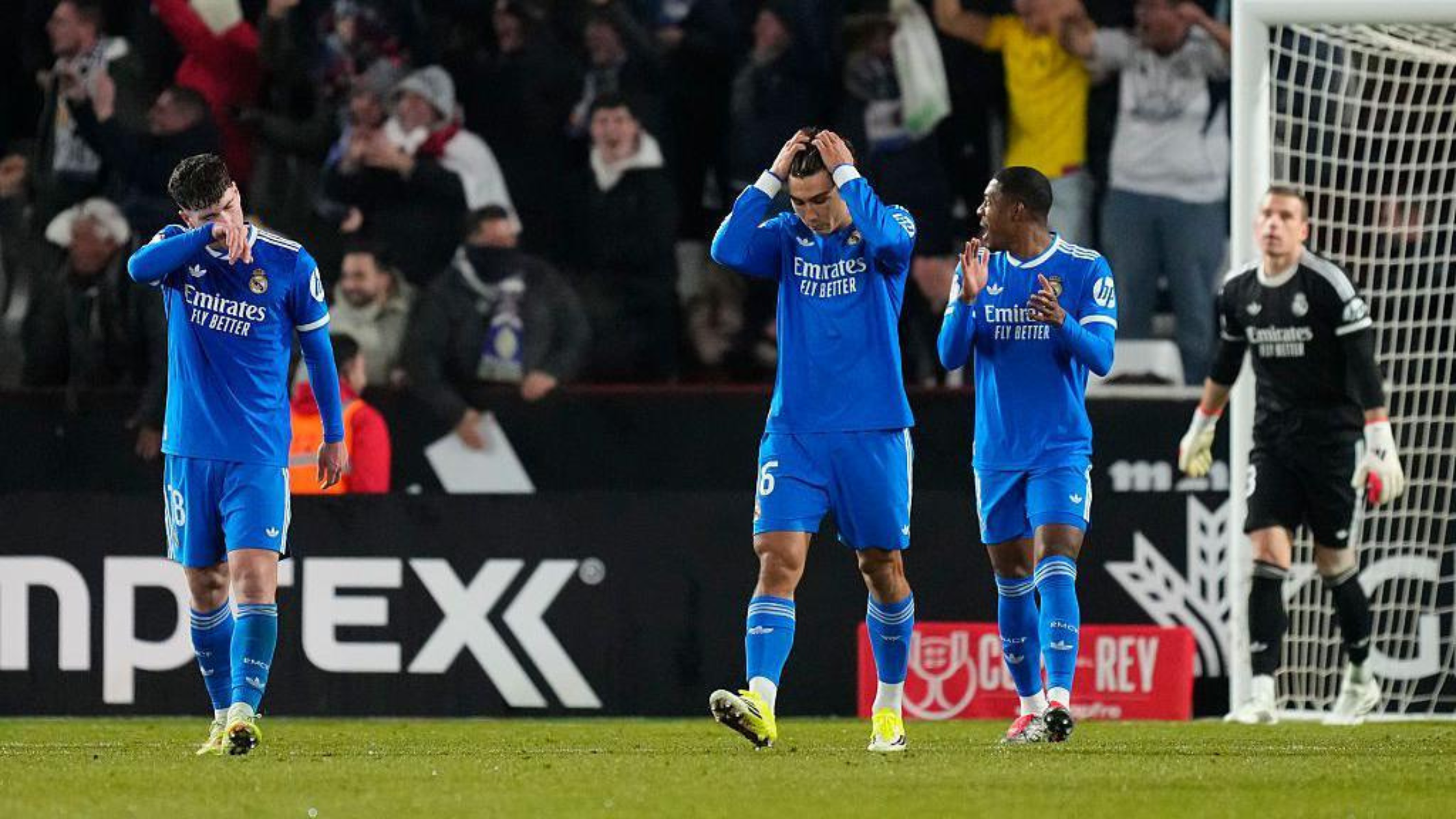 Real Madrid players holding their heads in shame after crashing out of the Spanish cup by Albacete