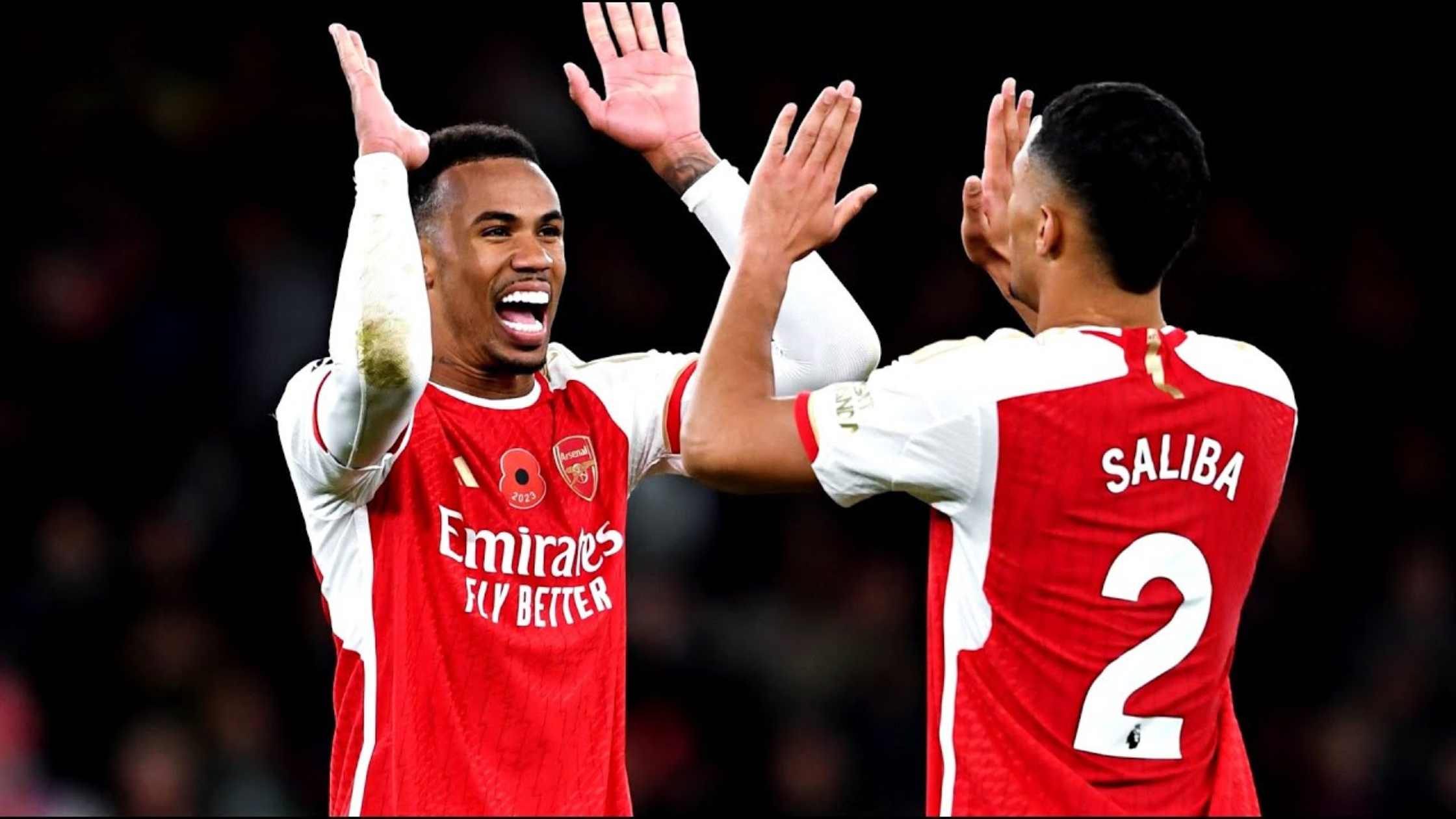 Gabriel and Saliba high fiving while playing for Arsenal
