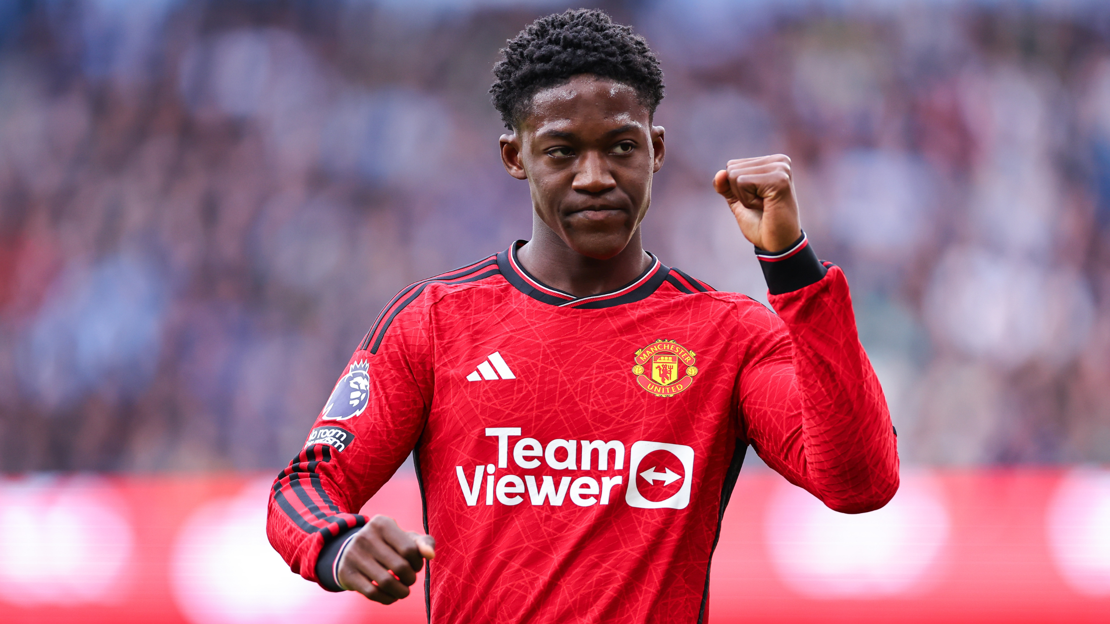 Frontview of Kobbie Mainoo pumping his fist