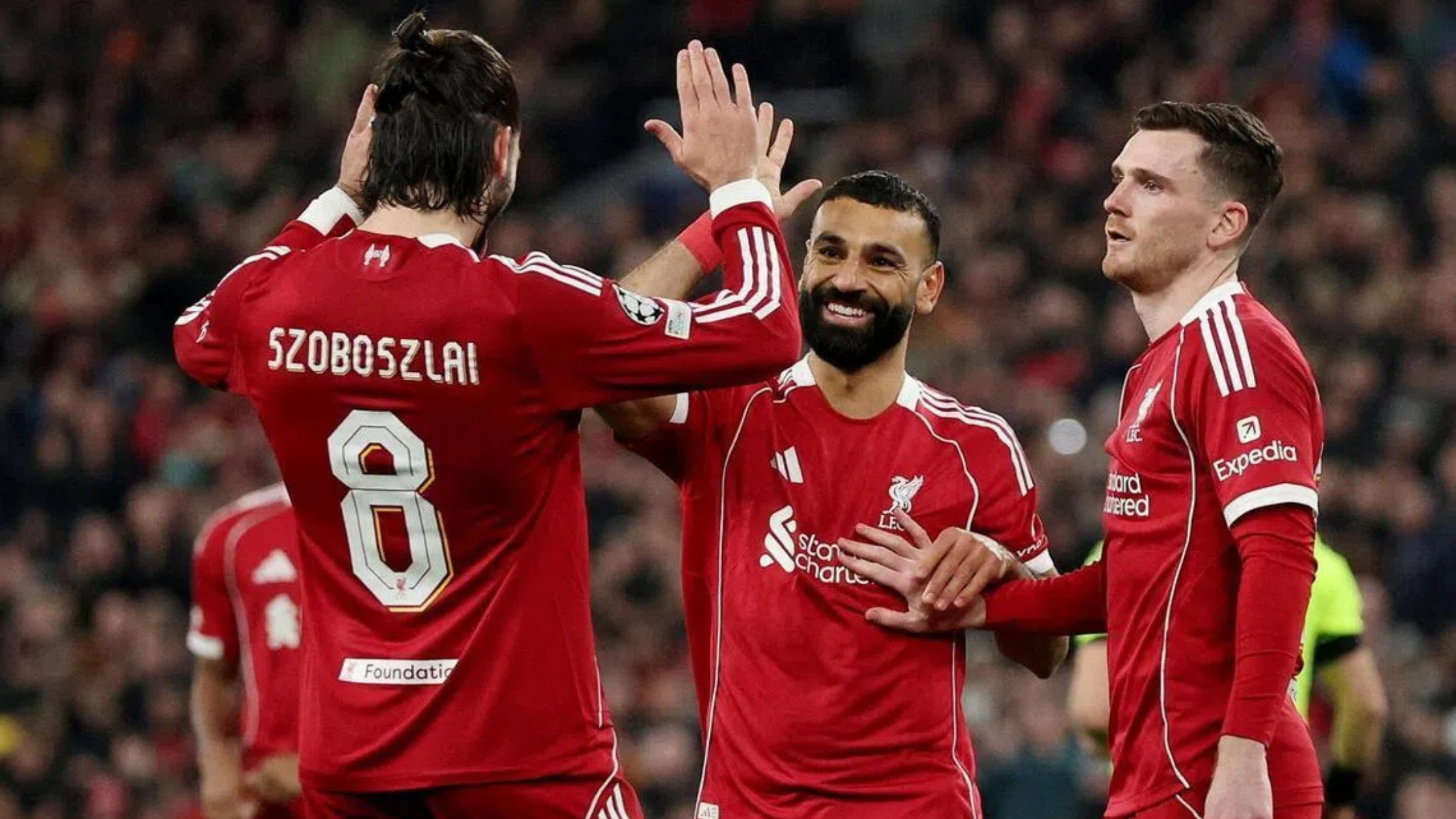 Играчите на Ливерпул, Доминик Собослај, Мохамед Салах и Енди Робертсон слават после постигнат гол против Карабах во Лигата на Шампионите